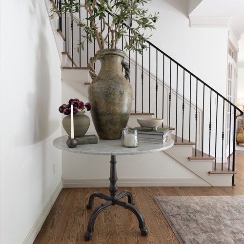 Elegant iron staircase with soft neutral tones in Denver residence