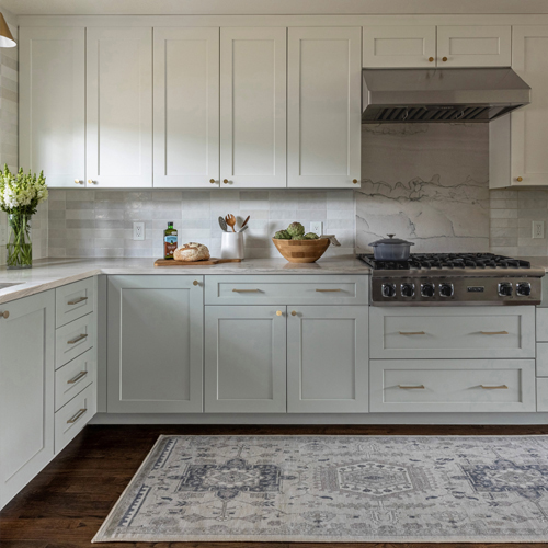 Transitional white kitchen with black counters in Denver green fixer-upper